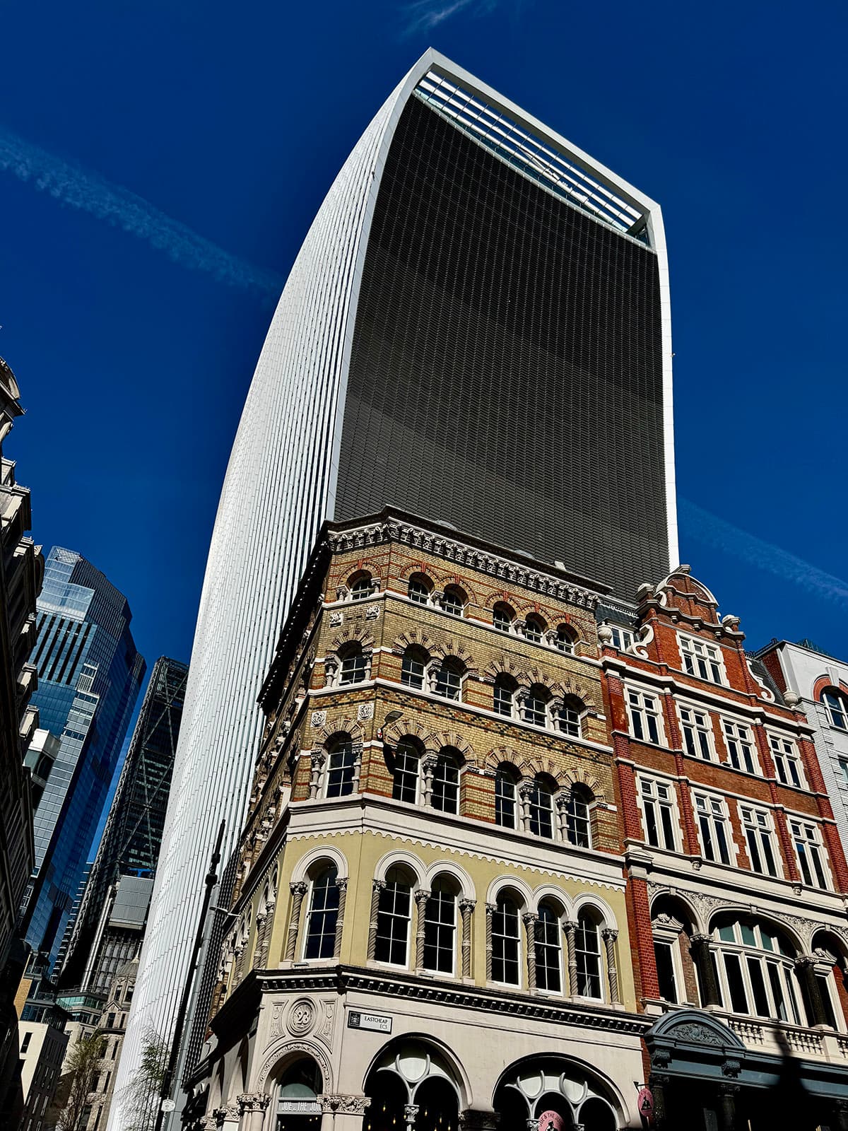 20 Fenchurch Street (the Walkie-Talkie) rising above Victorian buildings in the City of London